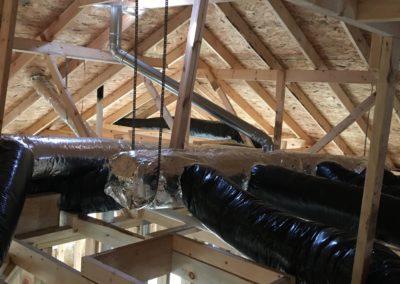Insulated ductwork in an attic of a new construction house